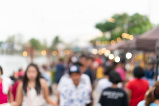 Blur the country river evening market Thai style with people relax and chill out bokeh background.