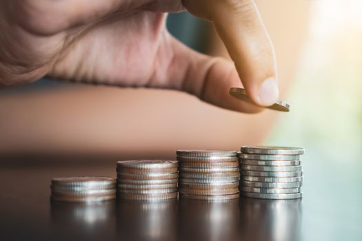 Business financial success concept. Gold coins on table and green nature bokeh background.Bullish market situation.