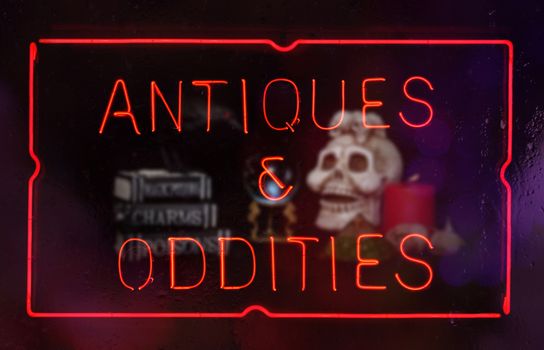 Oddities and Antiques Neon Sign in Shop Window Composite Image