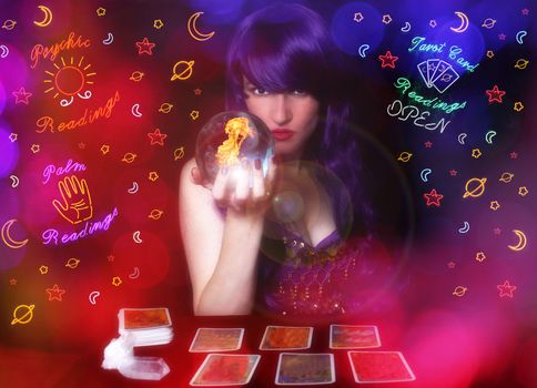 Psychic Tarot Card Reader with Purple hair and Crystal Ball. Neon Lights in background with Bokeh Effect