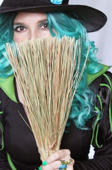 Witch With Green Hair and Broom on White Background