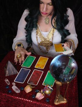 Psychic with green hair  Crystal Ball and tarot cards