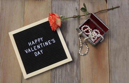 Happy Valentines Day Sign With Pearls in Jewelry Box