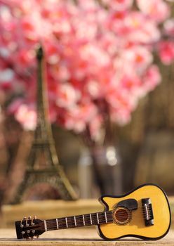 Guitar With Eiffel Tower Replica in Background