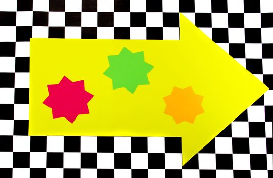 Photograph of Bright Neon Colored Shapes on Black and White Checkerboard pattern
