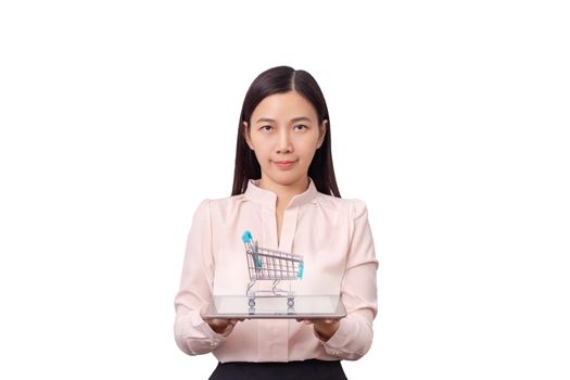 online shopping and E-commercial business concept. Asian beautiful woman holding tablet in hand with shopping cart on top isolated on white background.