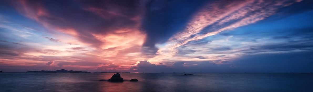 panorama view of beautiful sunset above the sea at tropical beach