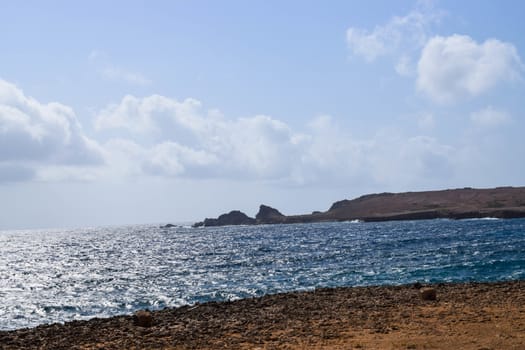 Arikok Natural Park on the island of Aruba in the Caribbean Sea with deserts and ocean waves on the rocky coast