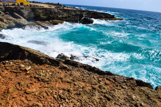 Arikok Natural Park on the island of Aruba in the Caribbean Sea with deserts and ocean waves on the rocky coast