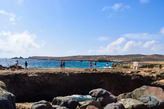 Arikok Natural Park on the island of Aruba in the Caribbean Sea with deserts and ocean waves on the rocky coast