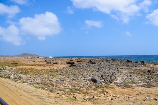 Arikok Natural Park on the island of Aruba in the Caribbean Sea with deserts and ocean waves on the rocky coast