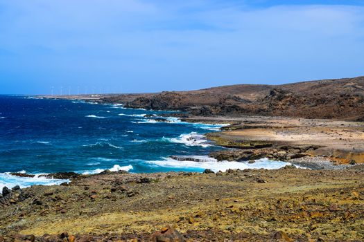 Arikok Natural Park on the island of Aruba in the Caribbean Sea with deserts and ocean waves on the rocky coast