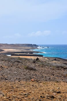 Arikok Natural Park on the island of Aruba in the Caribbean Sea with deserts and ocean waves on the rocky coast