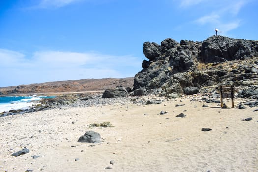 Arikok Natural Park on the island of Aruba in the Caribbean Sea with deserts and ocean waves on the rocky coast