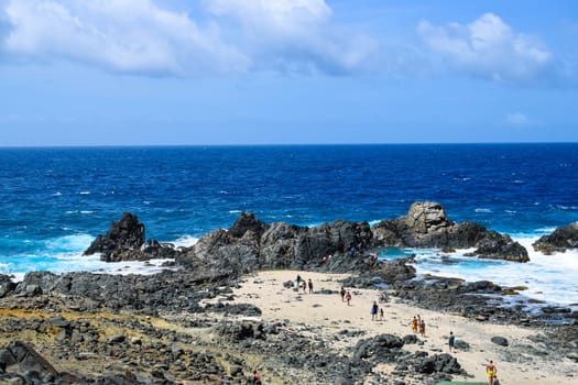 Arikok Natural Park on the island of Aruba in the Caribbean Sea with deserts and ocean waves on the rocky coast