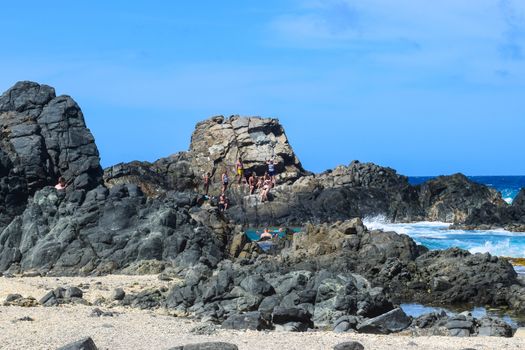 Arikok Natural Park on the island of Aruba in the Caribbean Sea with deserts and ocean waves on the rocky coast