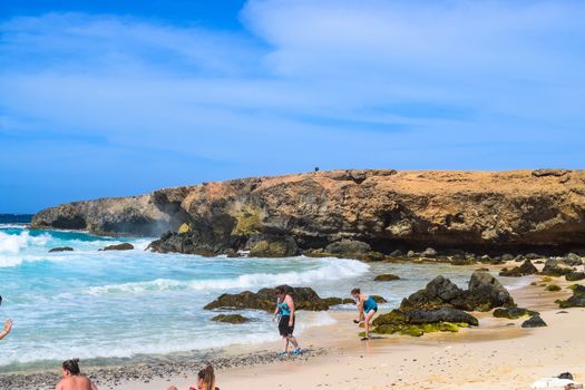 Arikok Natural Park on the island of Aruba in the Caribbean Sea with deserts and ocean waves on the rocky coast