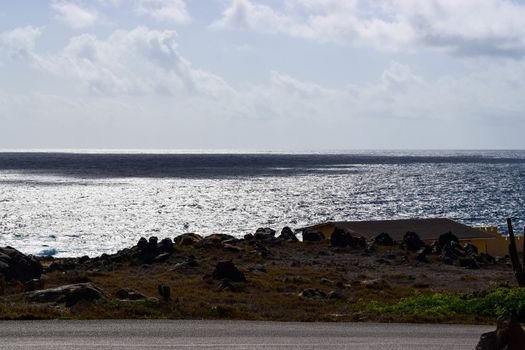 Arikok Natural Park on the island of Aruba in the Caribbean Sea with deserts and ocean waves on the rocky coast