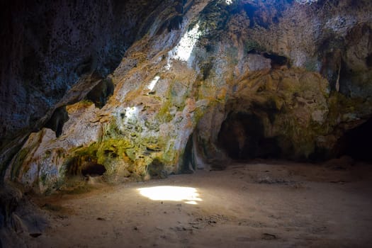 Arikok Natural Park on the island of Aruba in the Caribbean Sea with deserts and ocean waves on the rocky coast