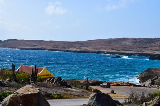 Arikok Natural Park on the island of Aruba in the Caribbean Sea with deserts and ocean waves on the rocky coast