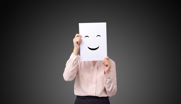 businesswoman holding a card with drawing facial expressions illustrations emotion feelings face on white paper