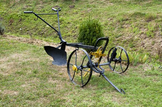 old horse plow set on the grass