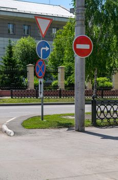 absurd, a contradiction of traffic signs on city streets. Errors of city symbols on the road