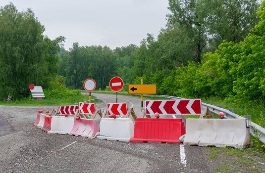 stop, detour, road signs, repair of the road on the country road closed for journey