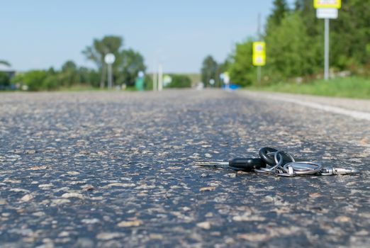 Lost a bunch of keys lying on the asphalt surface of the roadway