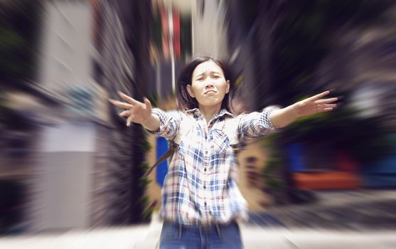 Asian woman falling from high building to the ground trying to raise her hand for help with sad emotion face