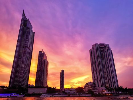 beautiful Bangkok city view with high building at riverside at the dusk with colorful of twilight sky in the evening after sunset time