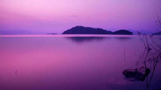 beautiful nature view of lake in the dusk at sunset time, violet tone