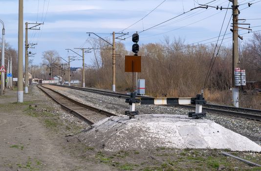 Railway impasse on the railroad tracks on the spring in Sunny weather