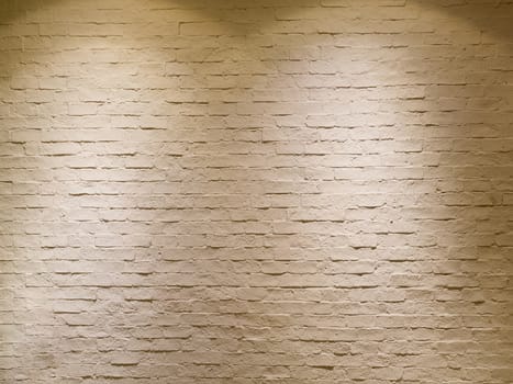 abstract empty weathered textured white brick wall background with two halogen lamps warm light on top as spotlight