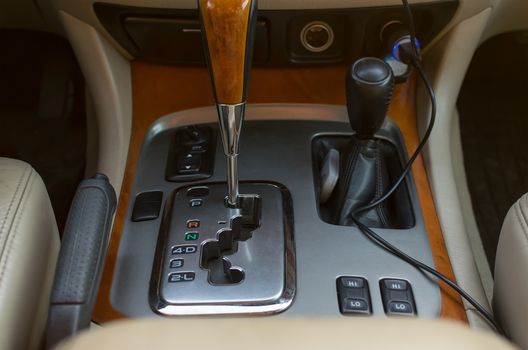 Automatic transmission control console and car interior are close up
