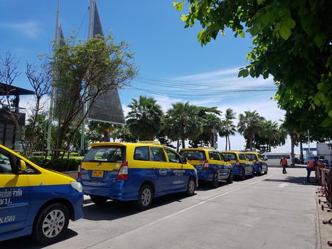 PATTATA, THAILAND - JUNE 29: blue yellow taxi-meters cab parking in the parking lots side of Central Festival Pattaya Beach shopping store on the JUNE 29,2018 in PATTATA, THAILAND