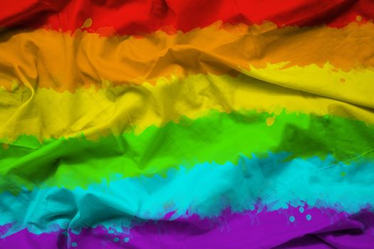 rainbow flag of LGBTQ for Pride month on fabric texture with ripple