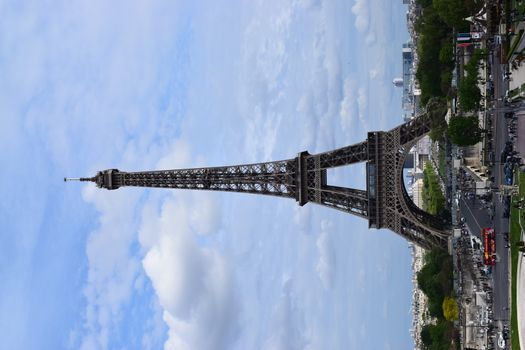 PARIS, FRANCE - APRIL 28, 2018: Beautiful view of the Eiffel Tower (Tour Eiffel) in a sunny spring day - Breathtaking view of the most known monument of Paris