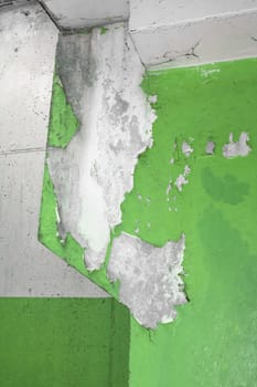 Close up of an old pillar with green peeling paint