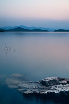 beautiful nature view of lake in the dusk at sunset time, blue tone