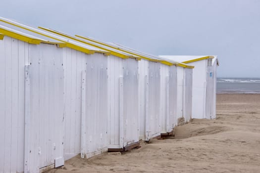 White cabins on a beach in winter