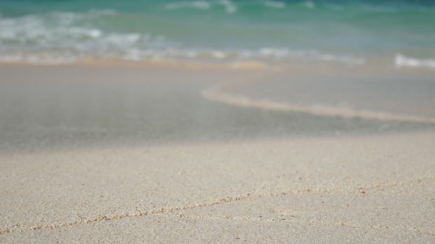 soft wave of blue ocean on sandy white beach. summer background.