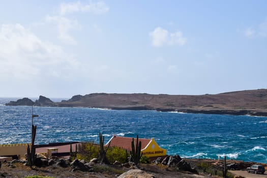 Arikok Natural Park on the island of Aruba in the Caribbean Sea with deserts and ocean waves on the rocky coast