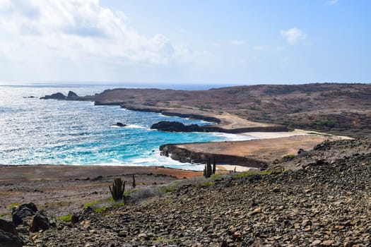 Arikok Natural Park on the island of Aruba in the Caribbean Sea with deserts and ocean waves on the rocky coast