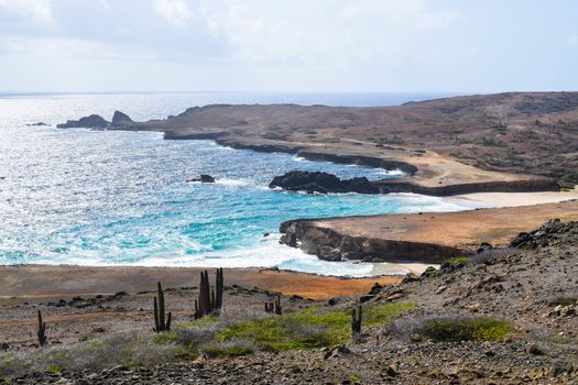 Arikok Natural Park on the island of Aruba in the Caribbean Sea with deserts and ocean waves on the rocky coast