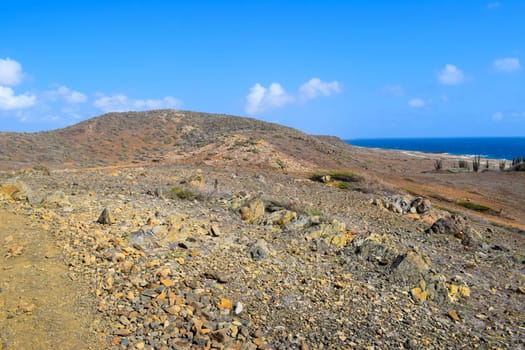 Arikok Natural Park on the island of Aruba in the Caribbean Sea with deserts and ocean waves on the rocky coast