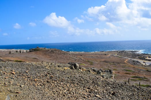 Arikok Natural Park on the island of Aruba in the Caribbean Sea with deserts and ocean waves on the rocky coast