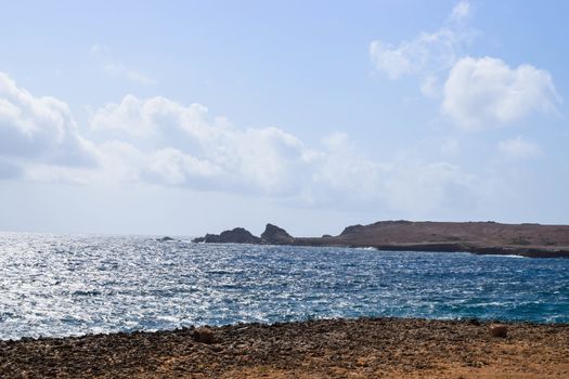 Arikok Natural Park on the island of Aruba in the Caribbean Sea with deserts and ocean waves on the rocky coast