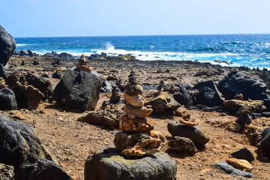 Arikok Natural Park on the island of Aruba in the Caribbean Sea with deserts and ocean waves on the rocky coast