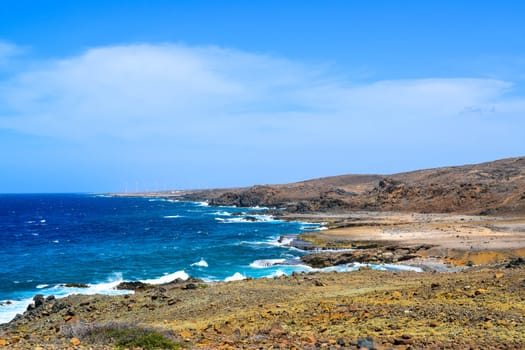 Arikok Natural Park on the island of Aruba in the Caribbean Sea with deserts and ocean waves on the rocky coast